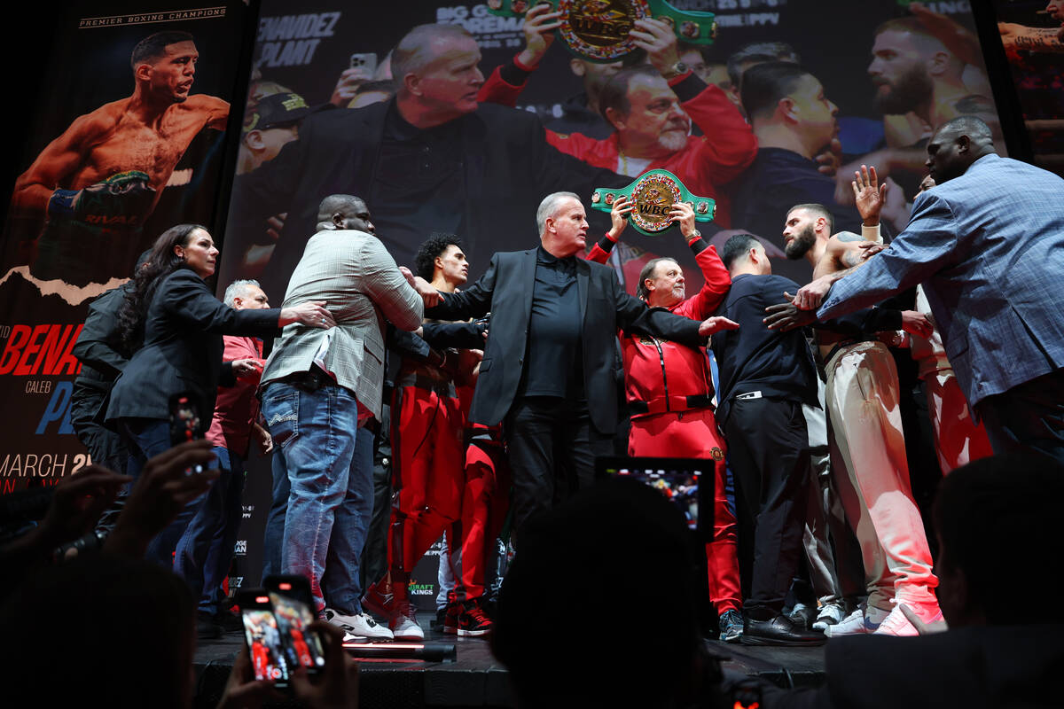 David Benavidez, left, and Caleb Plant, face off during a weigh-in event in advance of their su ...