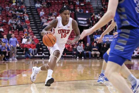 UNLV guard Keshon Gilbert (10) drives to the basket against the Air Force Falcons during the se ...