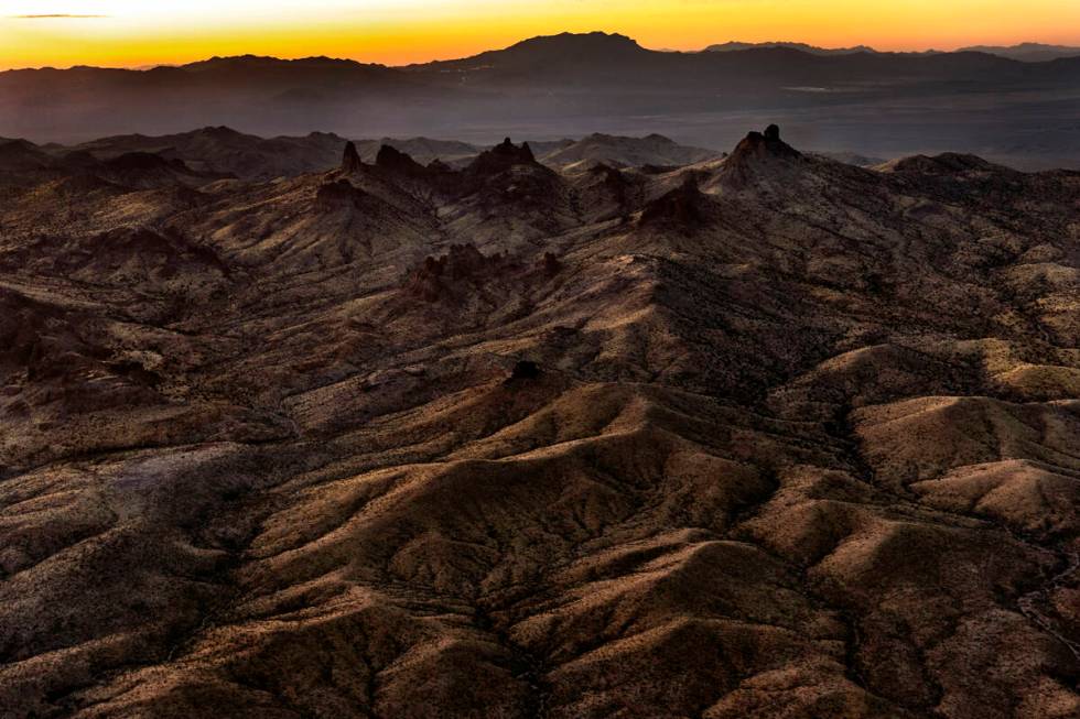 The sun sets beyond the Castle Mountains within the Avi Kwa Ame National Monument on Monday, Fe ...