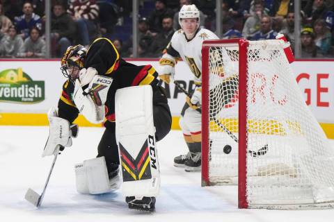 Vancouver Canucks goalie Thatcher Demko gives up a goal to Vegas Golden Knights' Reilly Smith, ...