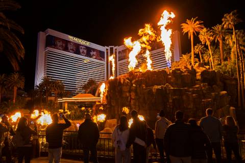 People watch the volcano show on the Strip outside The Mirage on Wednesday, Jan. 26, 2022, in L ...