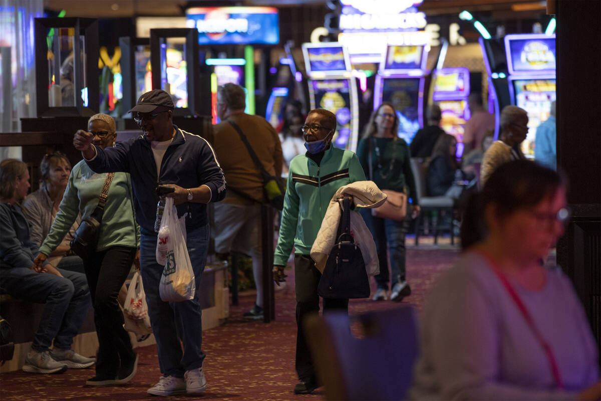 Guests pass by the casino floor at The Mirage on Wednesday, March 22, 2023, in Las Vegas. The M ...