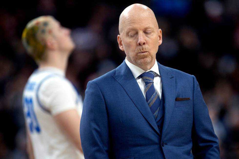 UCLA Bruins head coach Mick Cronin walks into a timeout huddle during the second half of a West ...