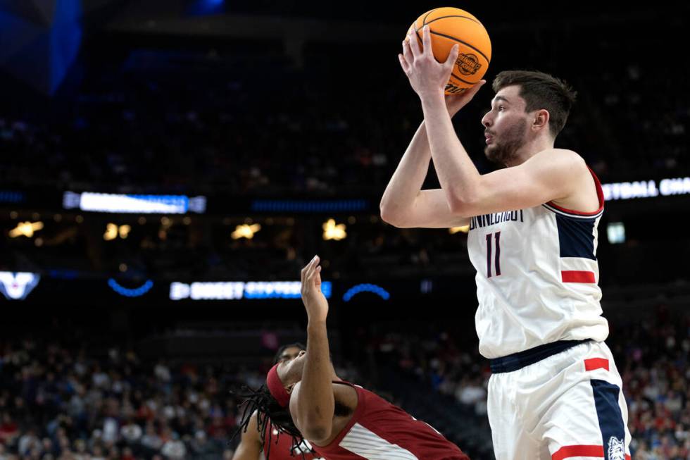 Connecticut Huskies forward Alex Karaban (11) shoots against Arkansas Razorbacks guard Ricky Co ...