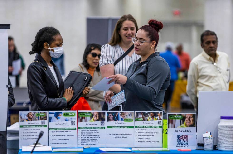 Procaps Laboratories staff talk with job seekers as more than 100 employers at the annual Sprin ...