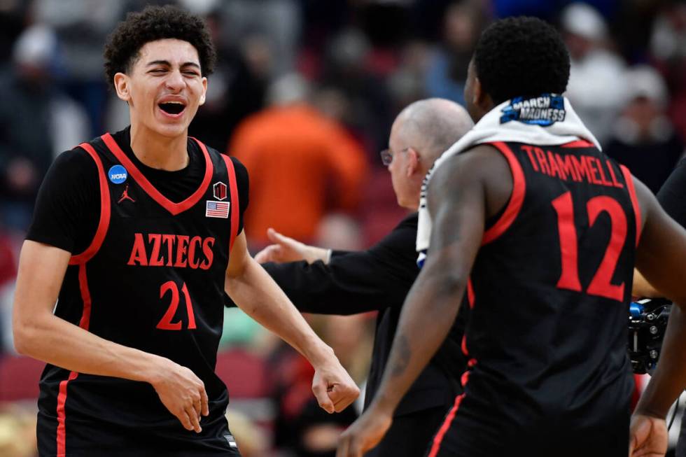 San Diego State's Miles Byrd (21) and Darrion Trammell (12) celebrate a win over Alabamaa in th ...