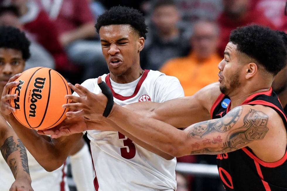 Alabama guard Rylan Griffen (3) battles for the ball against San Diego State guard Matt Bradley ...