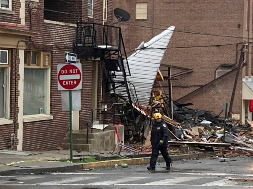Emergency personnel work at the site of a deadly explosion at a chocolate factory in West Readi ...