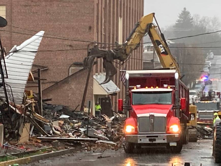 Rubble is cleared at the site of a deadly explosion at a chocolate factory in West Reading, Pa. ...