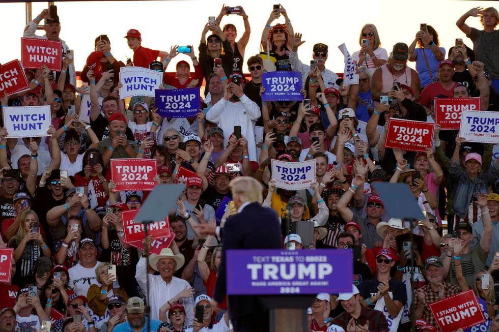 Supporters cheer former President Donald Trump as speaks at a campaign rally at Waco Regional A ...