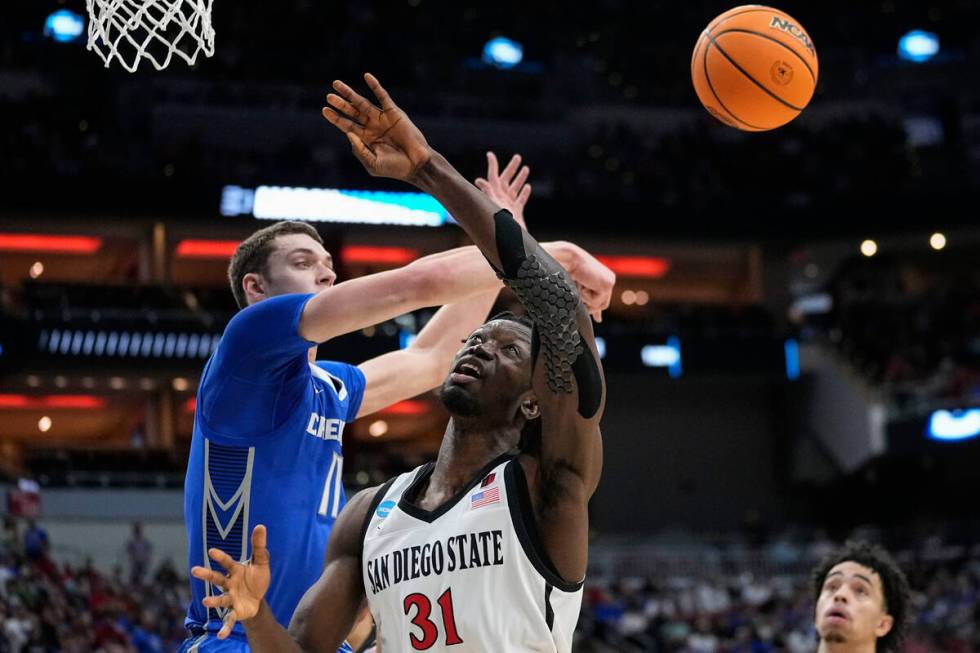 Creighton center Ryan Kalkbrenner (11) defends against San Diego State forward Nathan Mensah (3 ...