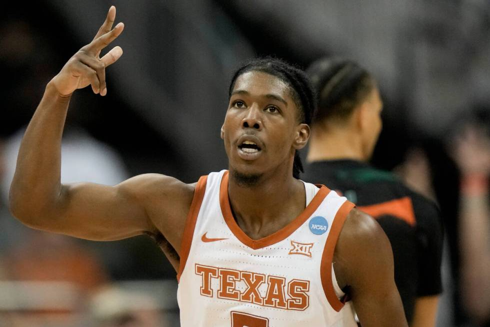 Texas guard Marcus Carr celebrates after scoring against Miami in the second half of an Elite 8 ...