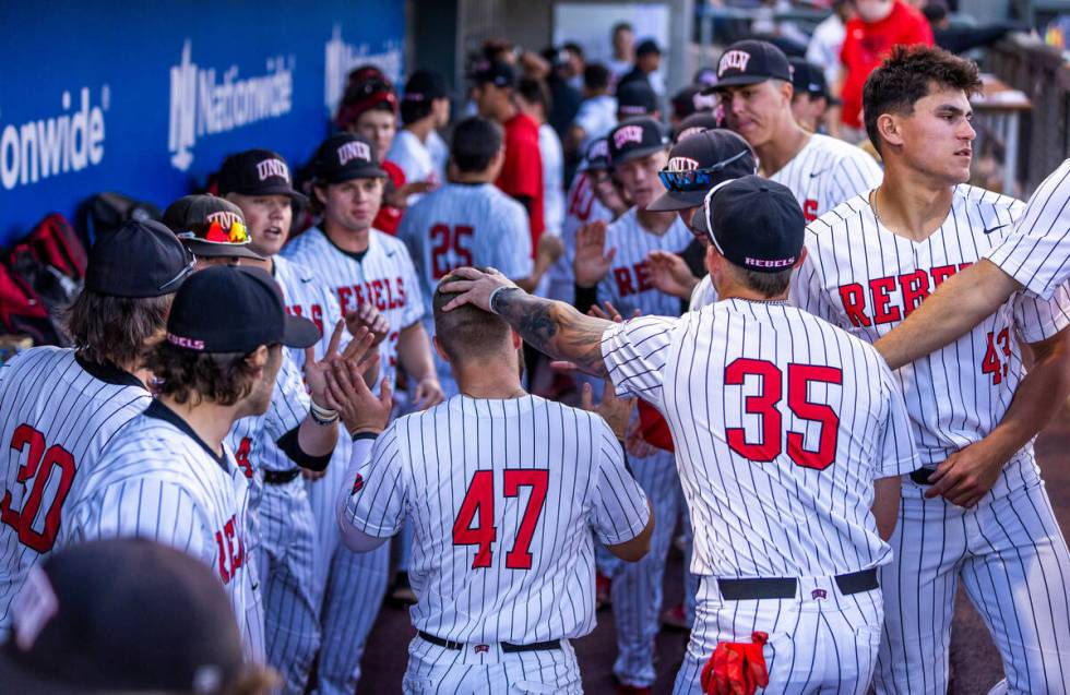 UNLV outfielder Austin Kryszczuk (47) is congratulated on a great catch against Arizona State d ...