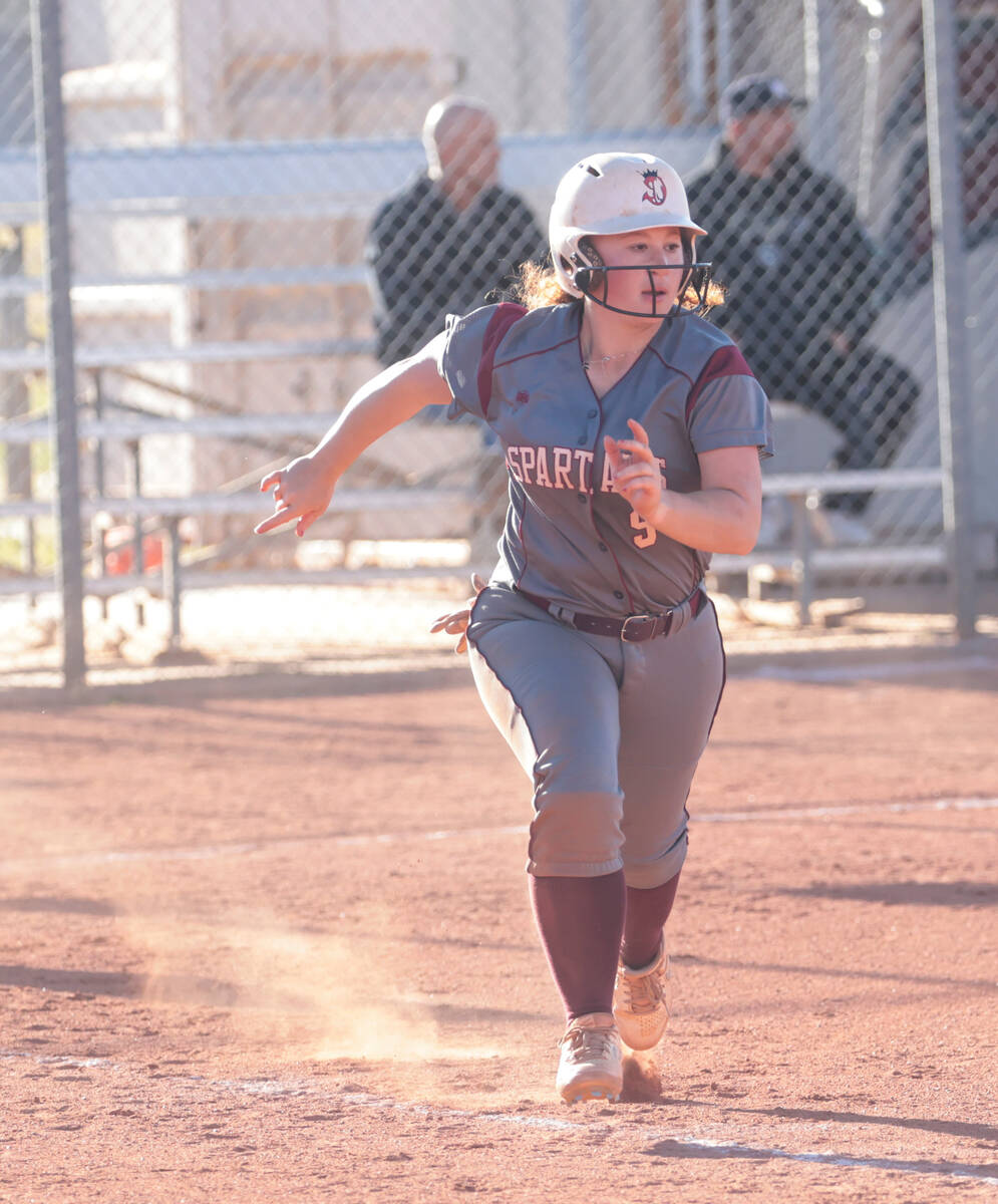 Cimarron-Memorial's Haileigh Seigel (9) runs to second base against Spring Valley during a soft ...