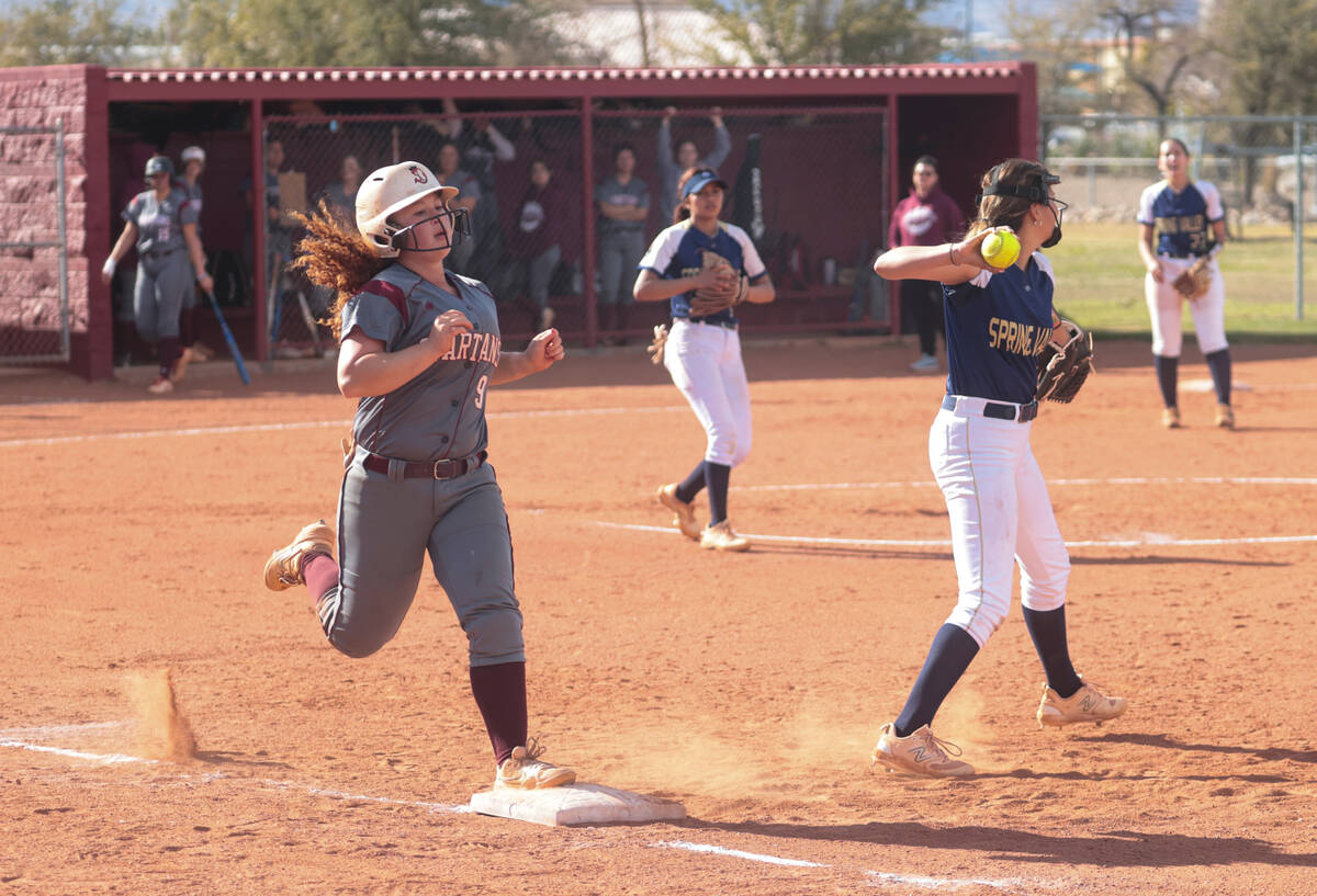 Cimarron-Memorial's Haileigh Seigel (9) gets forced out at first base by Spring Valley's Carlee ...