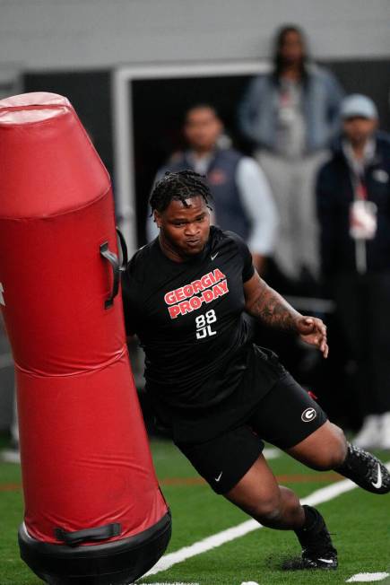 Former Georgia defensive lineman Jalen Carter runs football drills during Georgia's Pro Day, We ...