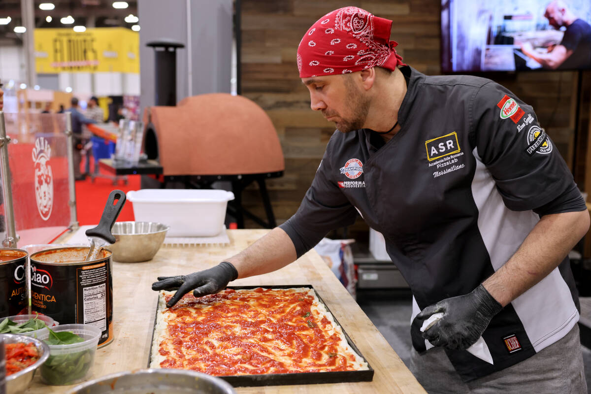 Pizza Artista Massimiliano Saieva of ASR PizzaLab academy prepares a pizza for sampling in the ...