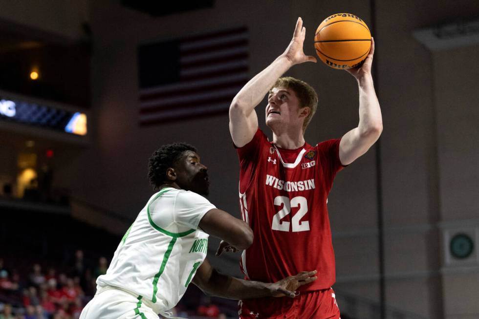 Wisconsin Badgers forward Steven Crowl (22) shoots against North Texas Mean Green forward Moula ...