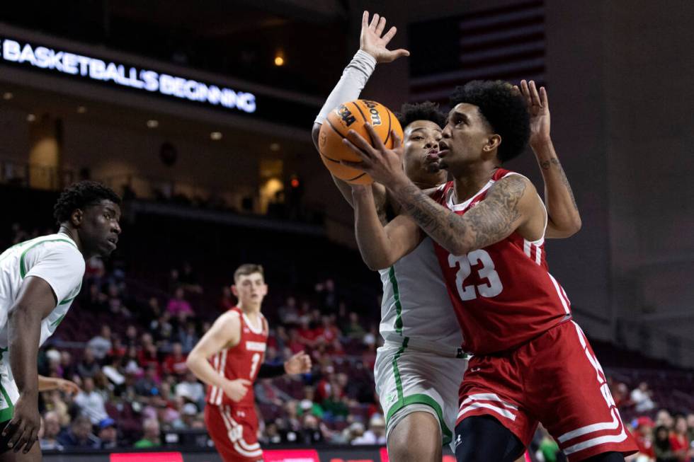 Wisconsin Badgers guard Chucky Hepburn (23) shoots against North Texas Mean Green guard Kai Hun ...