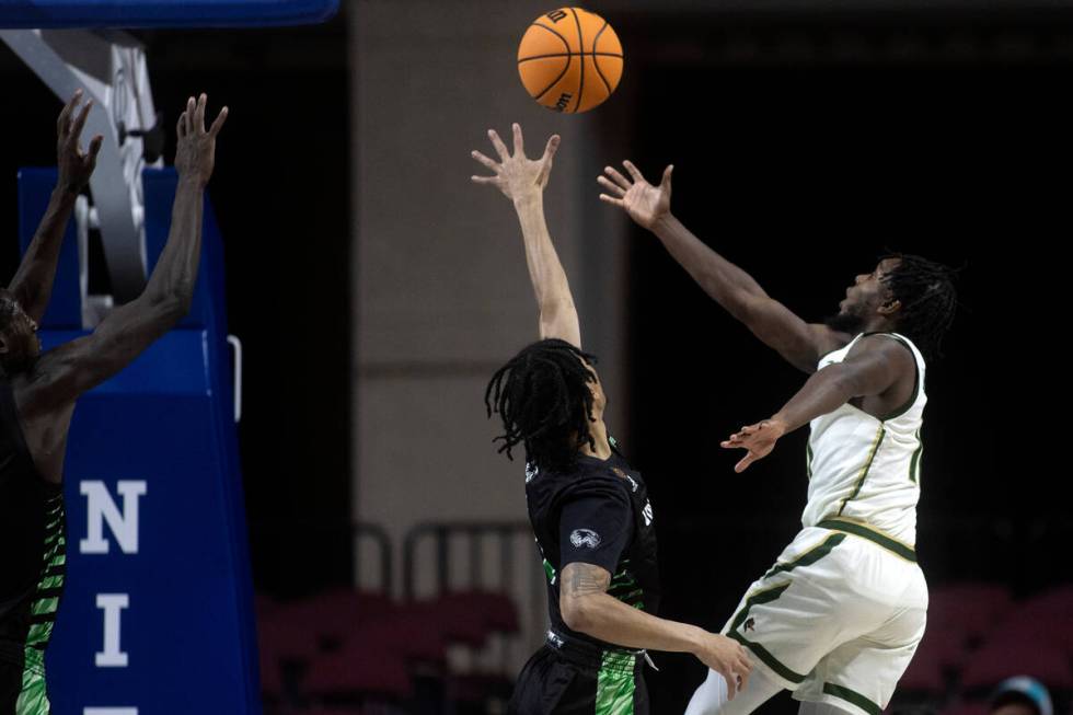 UAB Blazers guard Jordan Walker (10) shoots against Utah Valley Wolverines guard Tahj Small (11 ...