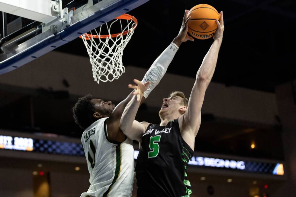 UAB Blazers forward Javian Davis (0) blocks a shot by Utah Valley Wolverines forward Tim Fuller ...