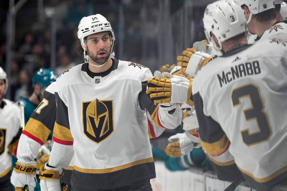 Vegas Golden Knights defenseman Nicolas Hague (14) is congratulated by teammates after his goal ...