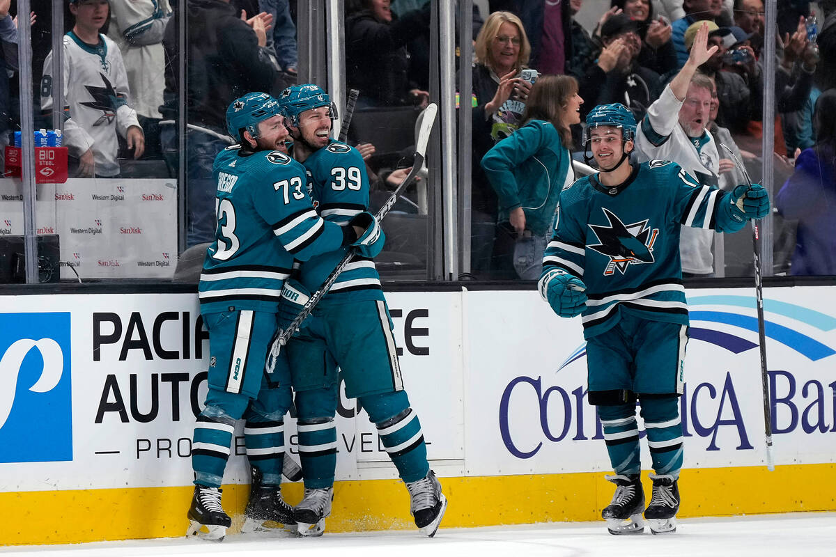 San Jose Sharks center Logan Couture (39) celebrates with Noah Gregor (73) and Thomas Bordeleau ...