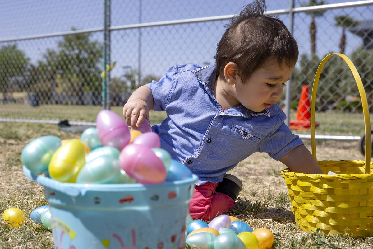 Dany Alubaidi, 1, opens his loot during the Egg-Apalooza Easter egg hunt at the Paradise Recrea ...