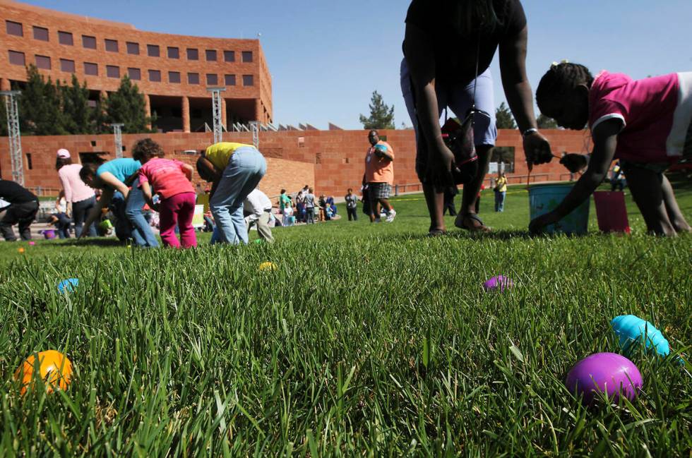 Local foster care children and their foster parents take part in the annual Easter egg hunt at ...