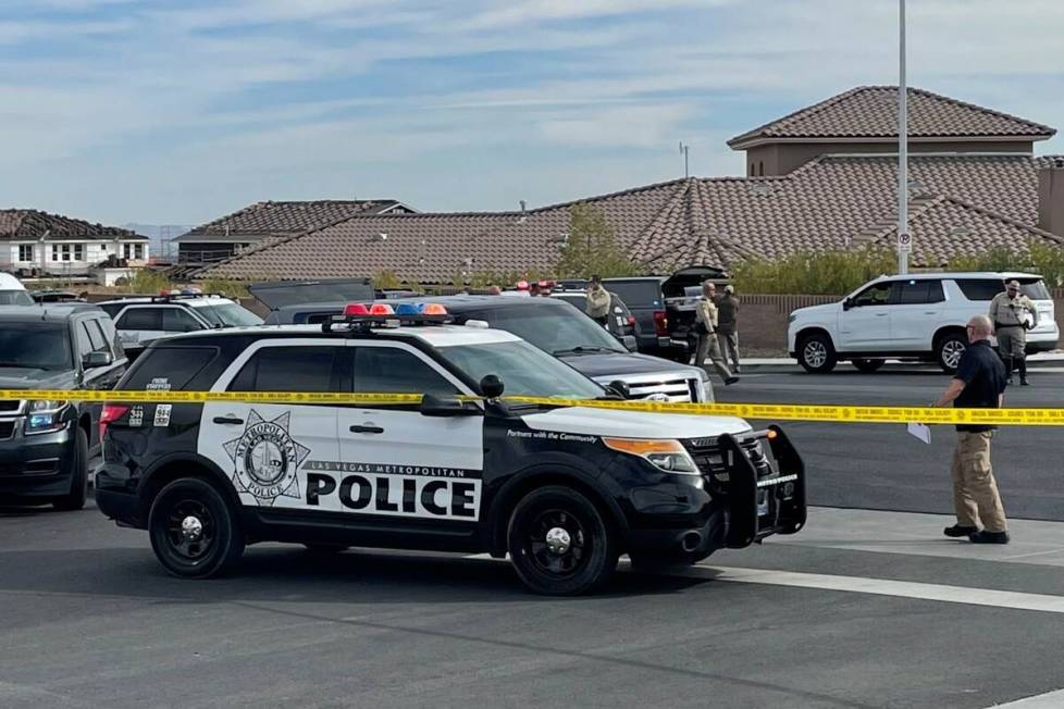 Las Vegas police and the FBI investigate a shooting on the 5000 block of Ruffian Road, near Wes ...