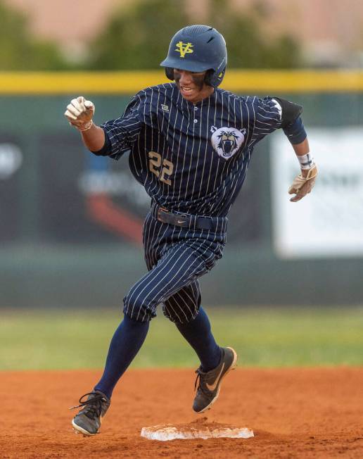 Spring Valley batter Royce Ogawa turns the corner at second base after hitting a triple versus ...