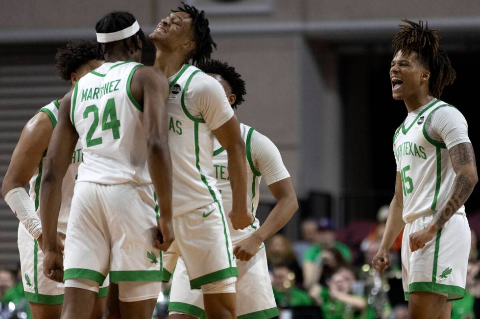 North Texas Mean Green forward Jayden Martinez (24), guard Aaron Scott, second from left, and g ...