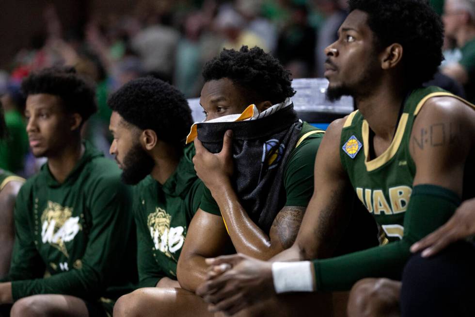 The UAB Blazers bench reacts as their team is losing in the final seconds of a NCAA college cha ...