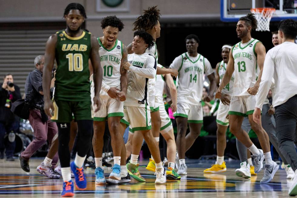 The North Texas Mean Green celebrate after winning the National Invitation Tournament champions ...