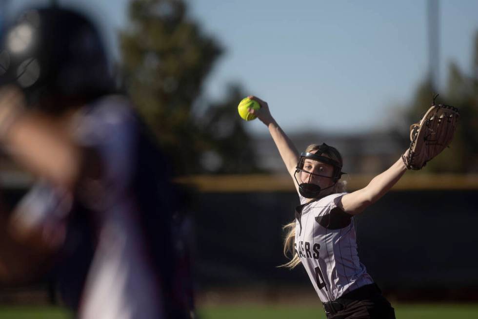 Faith Lutheran’s Jersie McDonald throws to Coronado during a high school softball game a ...