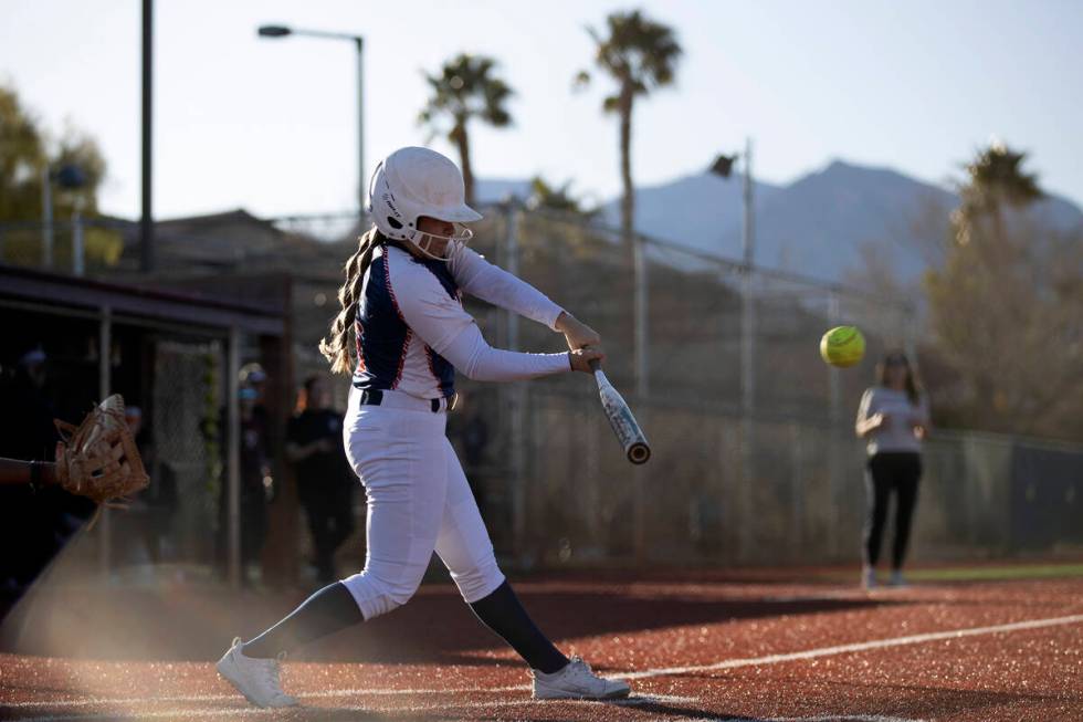 Coronado’s Jasmyn Lara swings at a Faith Lutheran pitch during a high school softball ga ...