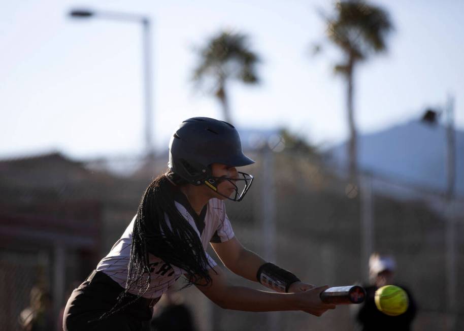 Faith Lutheran’s Ava Walker bunts during a high school softball game against Faith Luthe ...