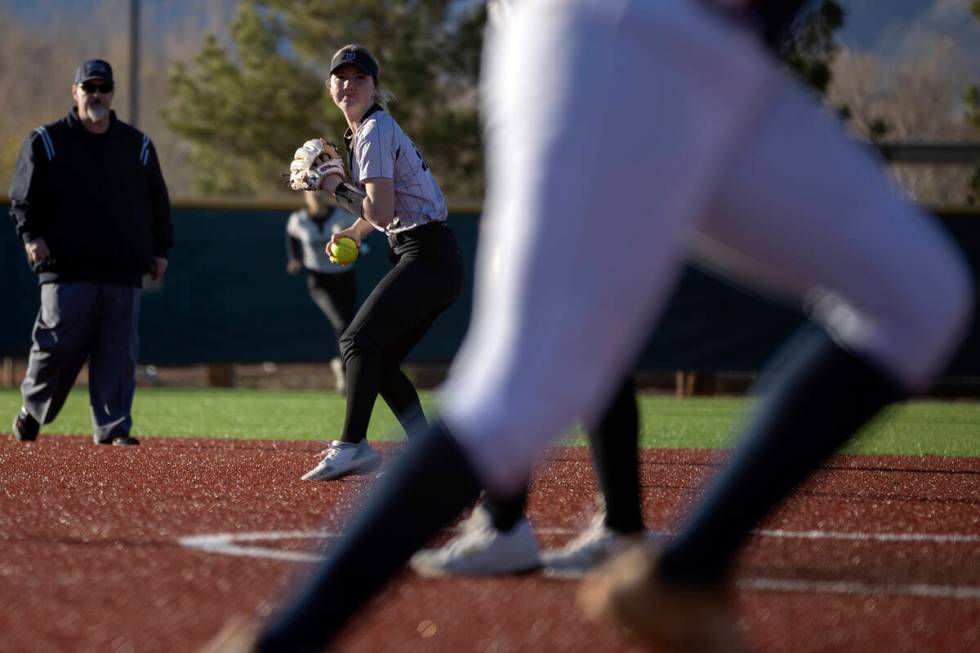 Faith Lutheran’s Savannah Moore throws to first during a high school softball game against Co ...