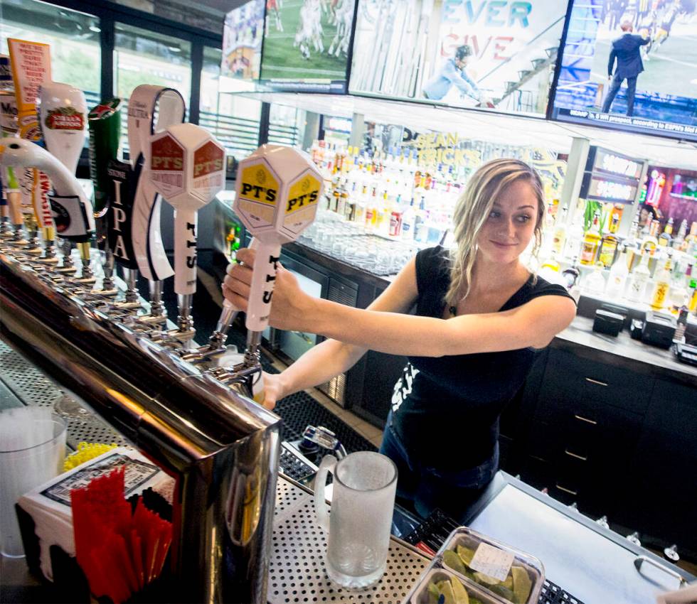 Bartender Bree Barlow pours a beer at PT's Tavern, the site of the former Beano's Casino, 7200 ...