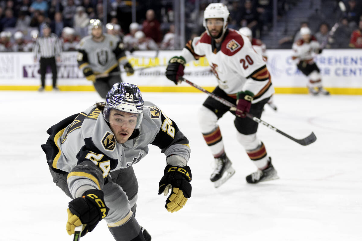 Henderson Silver Knights forward Brendan Brisson reaches for the puck during an AHL hockey game ...