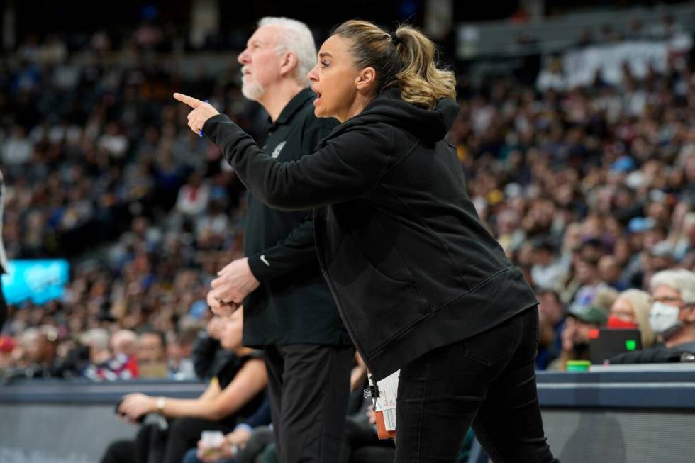 San Antonio Spurs assistant coach Becky Hammon, front, talks to players, next to coach Gregg Po ...