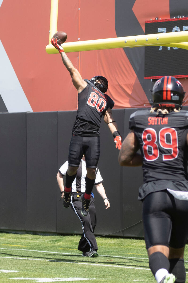 Vegas Vipers tight end Sean Price (80) spikes the ball over the uprights after scoring on a two ...