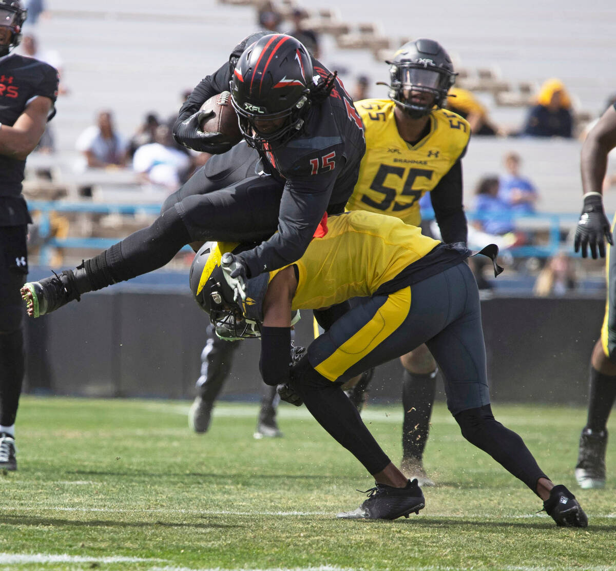 Vegas Vipers running back Rod Smith (15) hurdles over San Antonio Brahmas defensive back Luq Ba ...