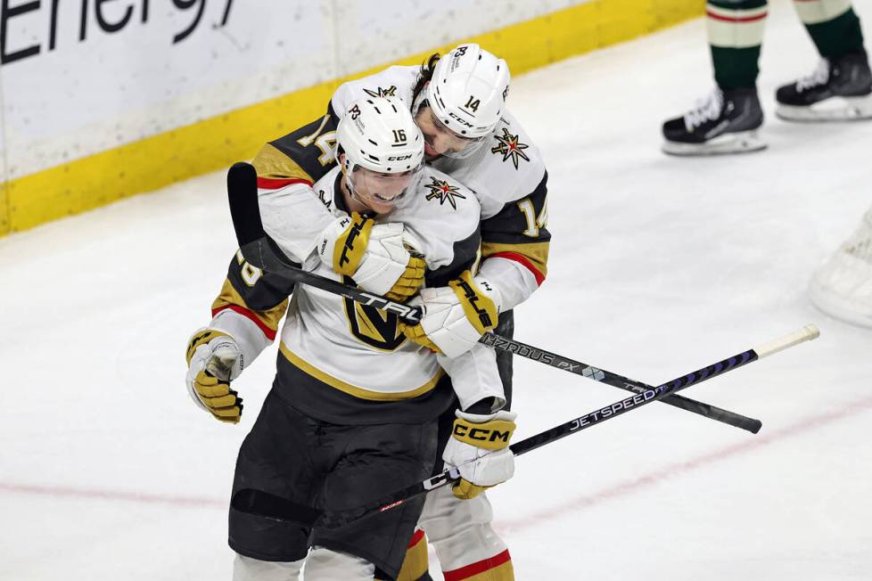 Vegas Golden Knights left wing Pavel Dorofeyev (16) celebrates with defenseman Nicolas Hague (1 ...