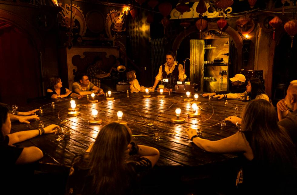 William Bradshaw, center, interacts with an Edison talking doll during the The Seance Room at L ...