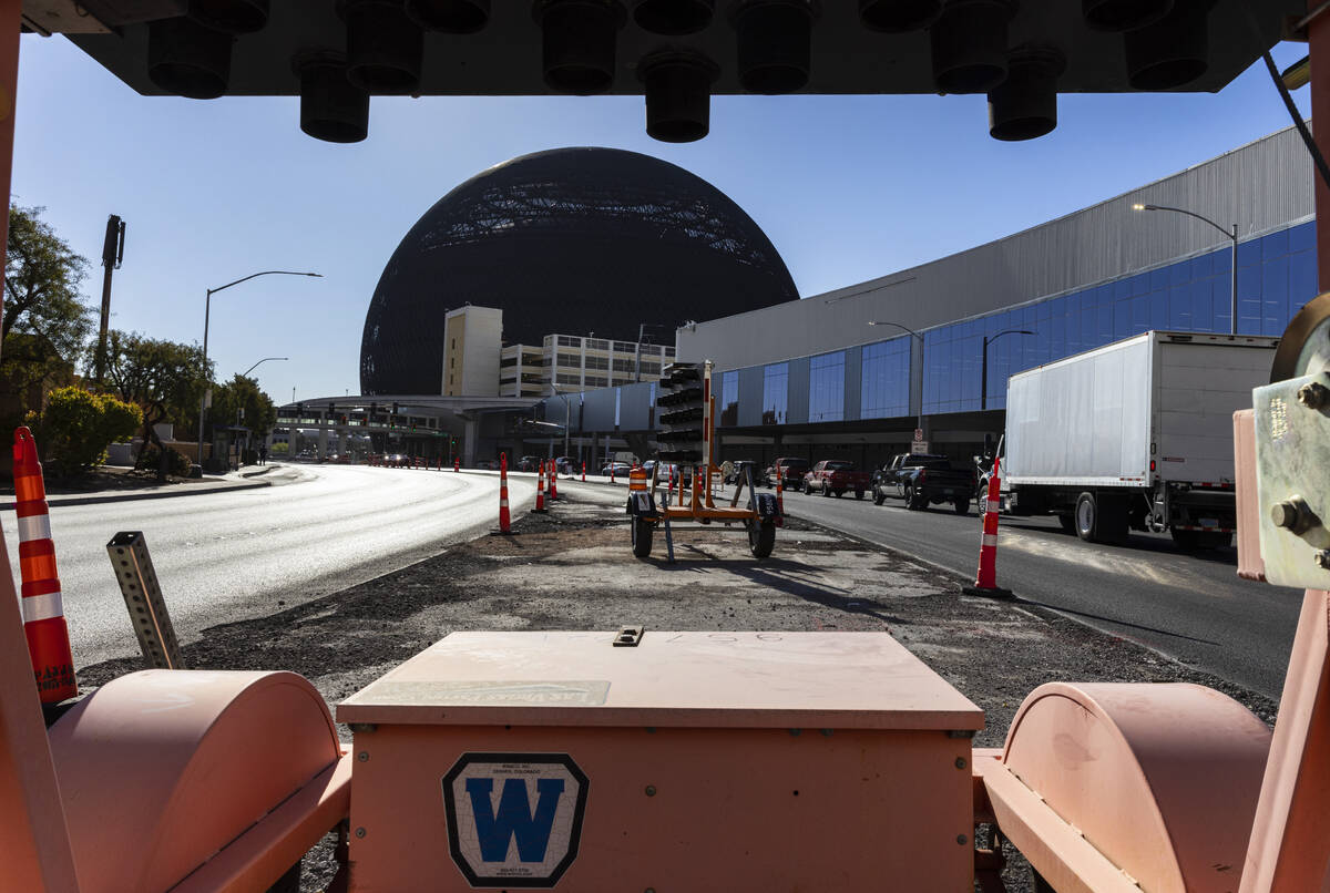 Traffic cones and road construction equipment are placed on Sands Avenue near the Venetian Expo ...