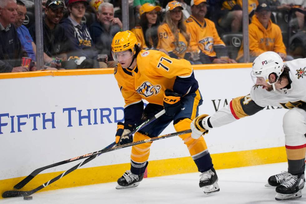 Nashville Predators right wing Luke Evangelista (77) skates the puck past Vegas Golden Knights ...