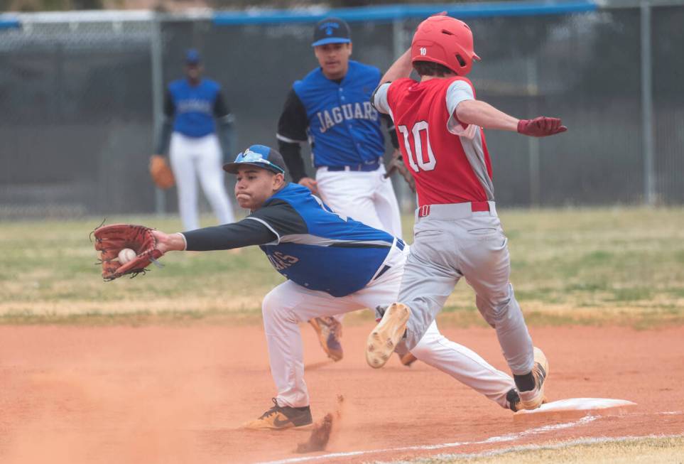 Desert Pines' Eric Milian (14) forces out Doral Academy's Maddox Fikkert (10) during a baseball ...