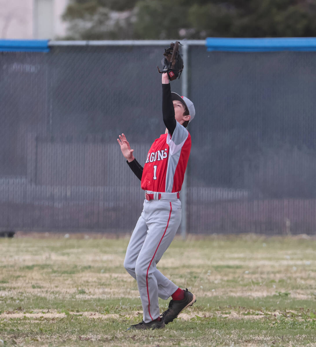 Doral Academy's Corin Masinter (1) catches a fly ball from Desert Pines during a baseball game ...