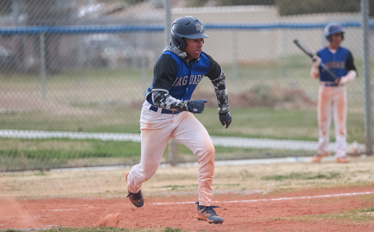 Desert Pines' Dupree Roby (3) runs for first base against Doral Academy during a baseball game ...